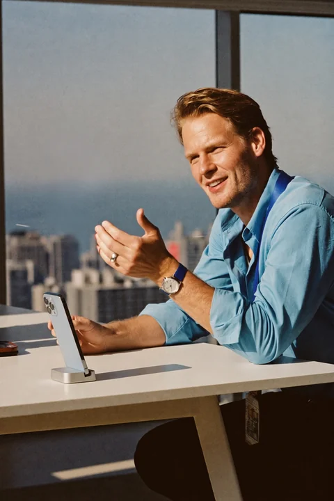 Advisor explaining options at a desk by the window