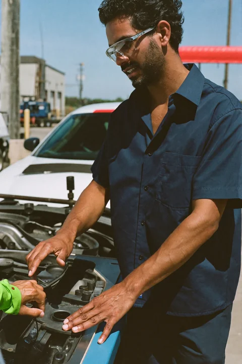 Engineer explaining a component on the factory floor